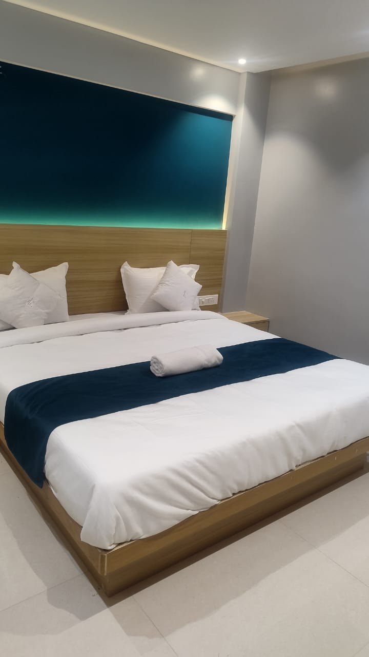 H-One cozy couple room with teal accent wall